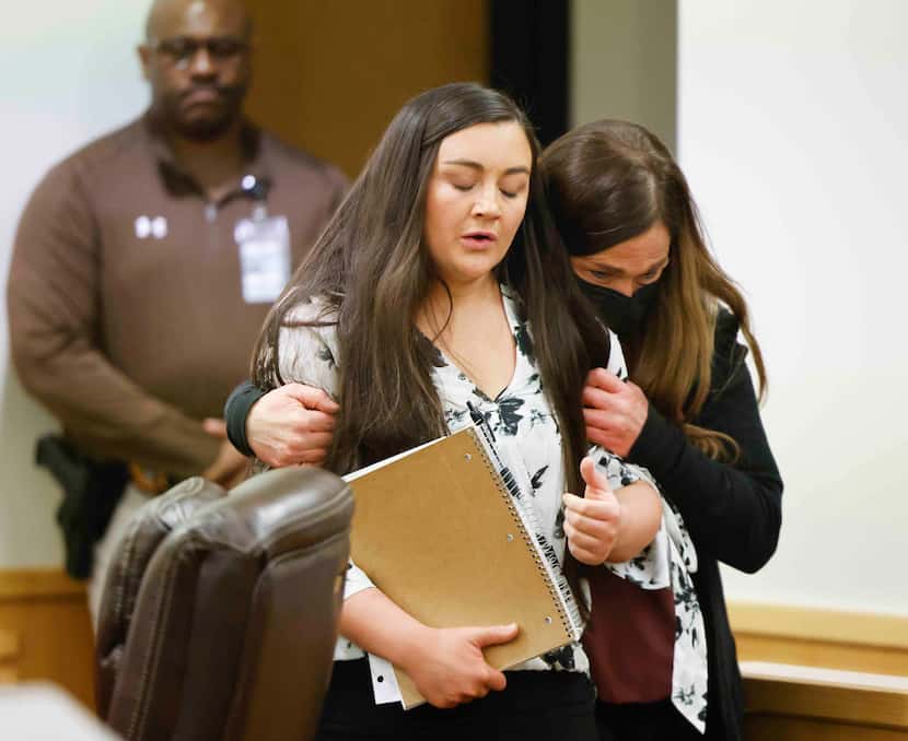 Kati Coates, left, a sexual assault survivor, becomes emotional while walking away after...