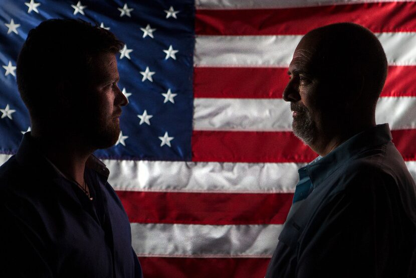 Charles Nelson, right, and his son Coty in their Leander home on July 2.