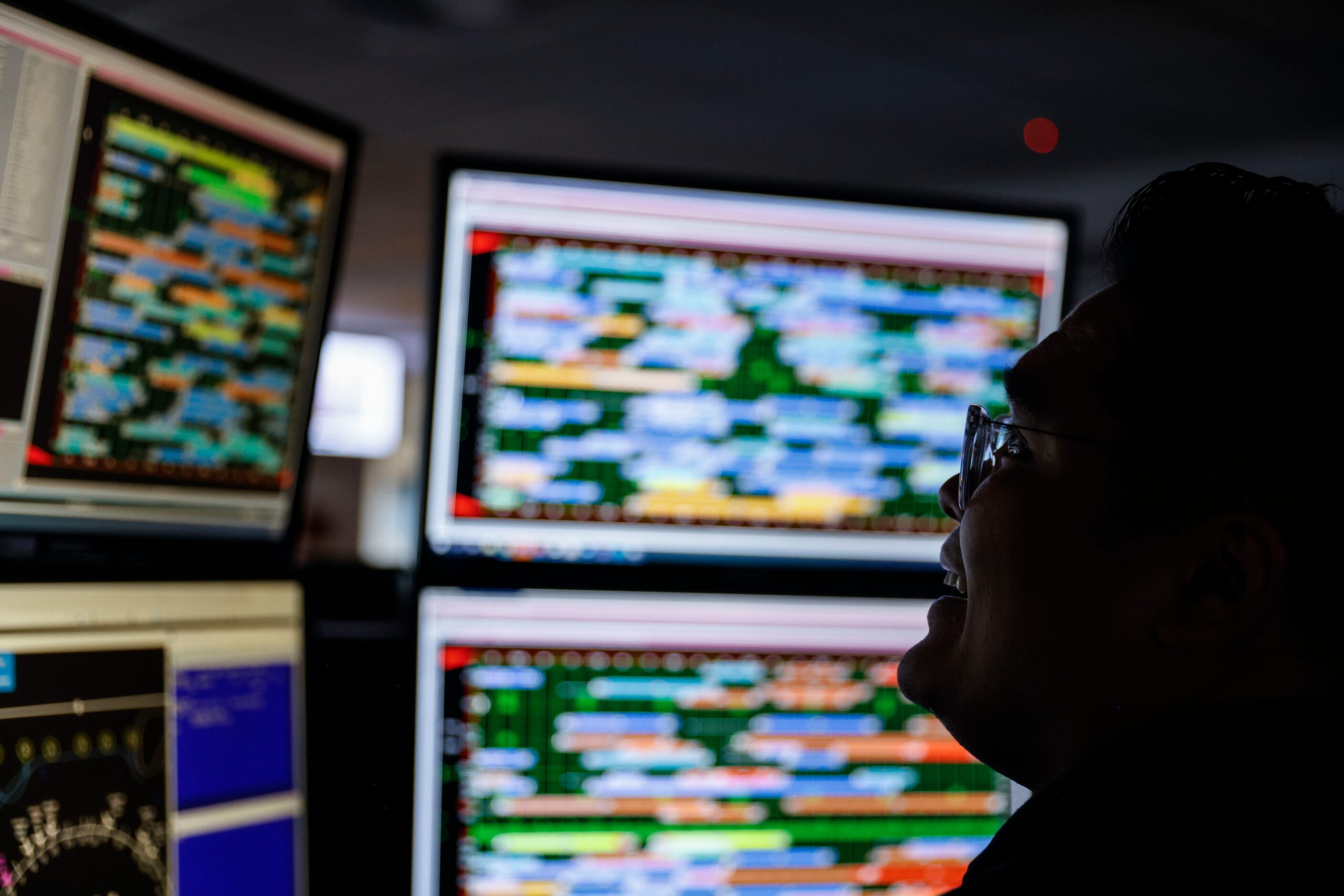 Athipong Yimsiriwattana, American Airlines fleet service agent, works in front of a screen...