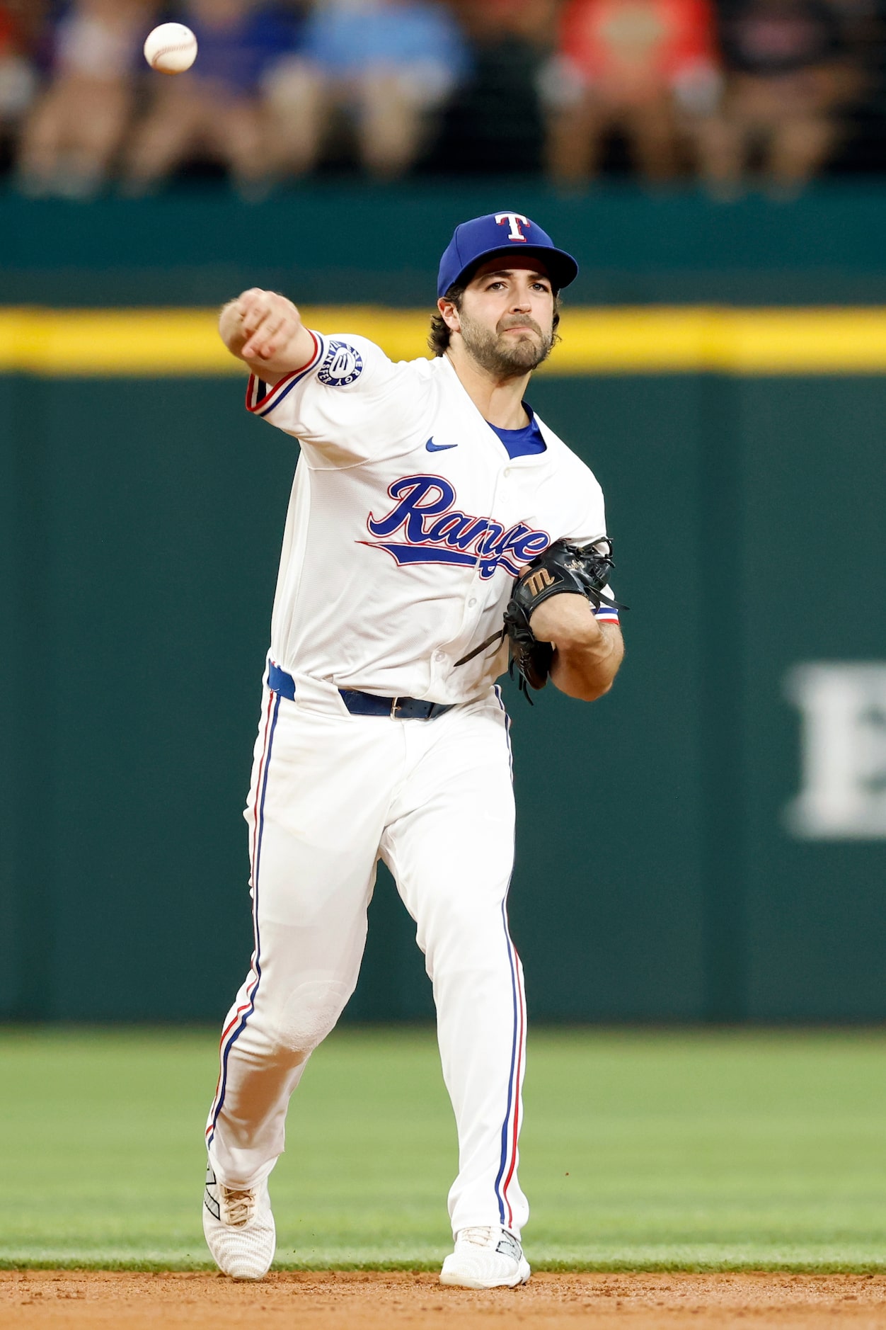 Texas Rangers shortstop Josh Smith (8) throws to first for an out during the third inning,...