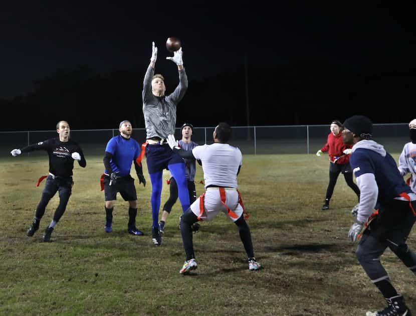 Prospective members of the National Gay Flag Football League practice during a scrimmage at...