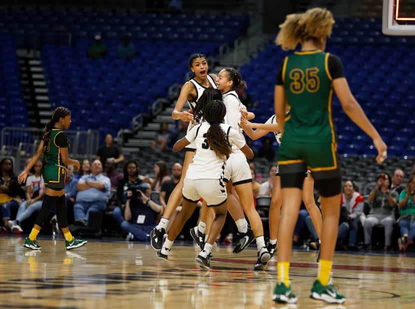 Desoto walk  off the court after Clark defeated DeSoto 42-37 in girls basketball Class 6A...