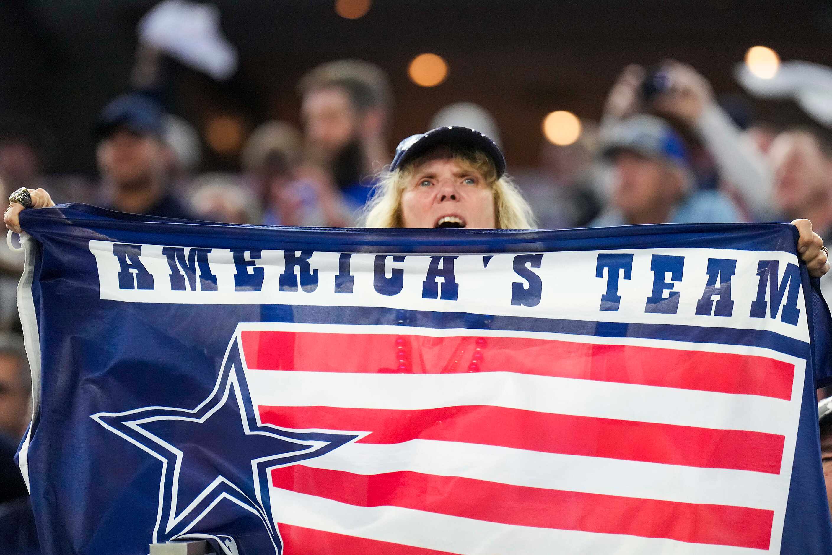 Dallas Cowboys fans cheer before an NFL football game against the Seattle Seahawks on...