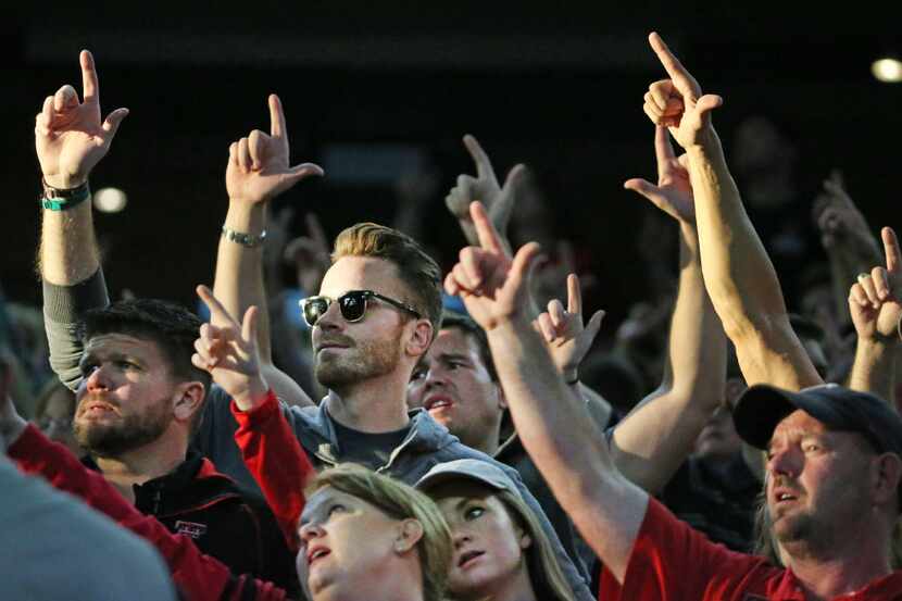 Texas Tech fans go "guns up" before kickoff during the Baylor University Bears vs. the Texas...