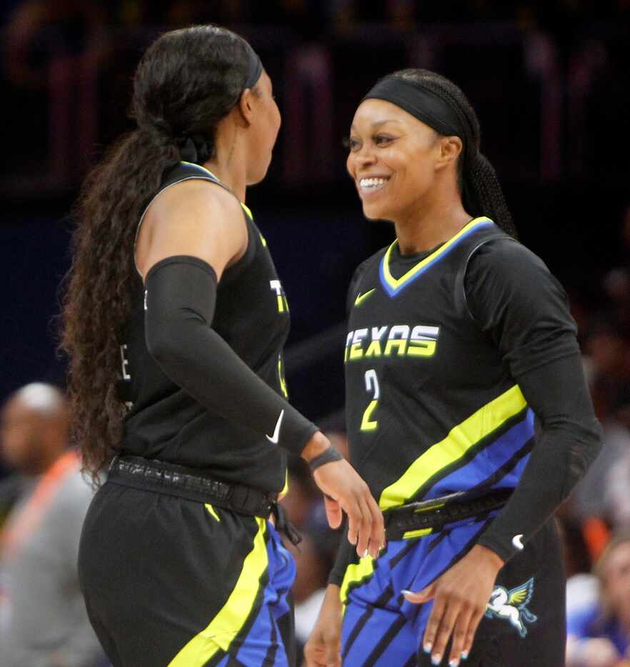 Dallas Wings guard Odyssey Sims (2), right, beams as she revels in the moment with teammate...