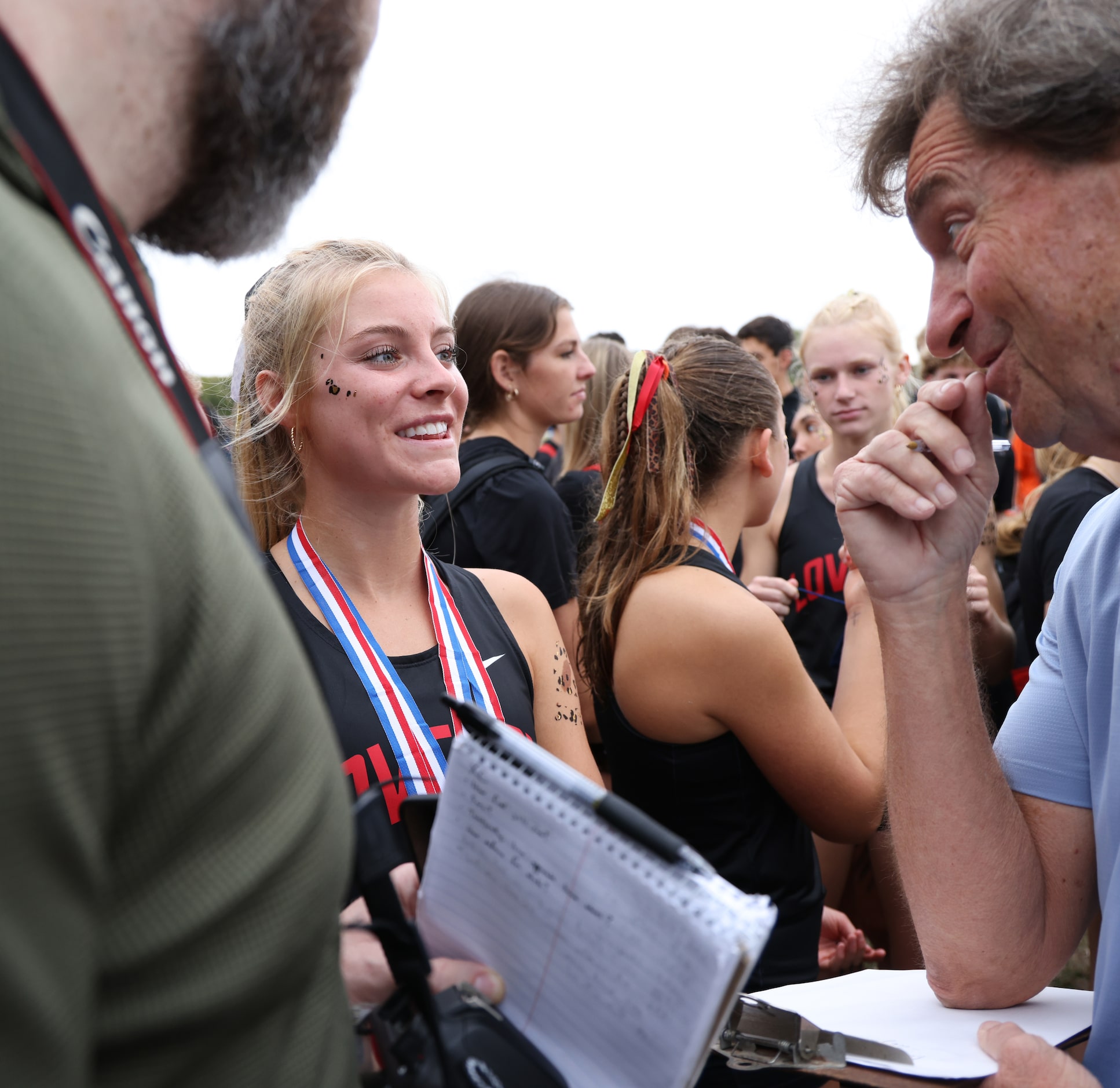 Lucas Lovejoy senior Sara Morefield, center, answers questions from media members after the...