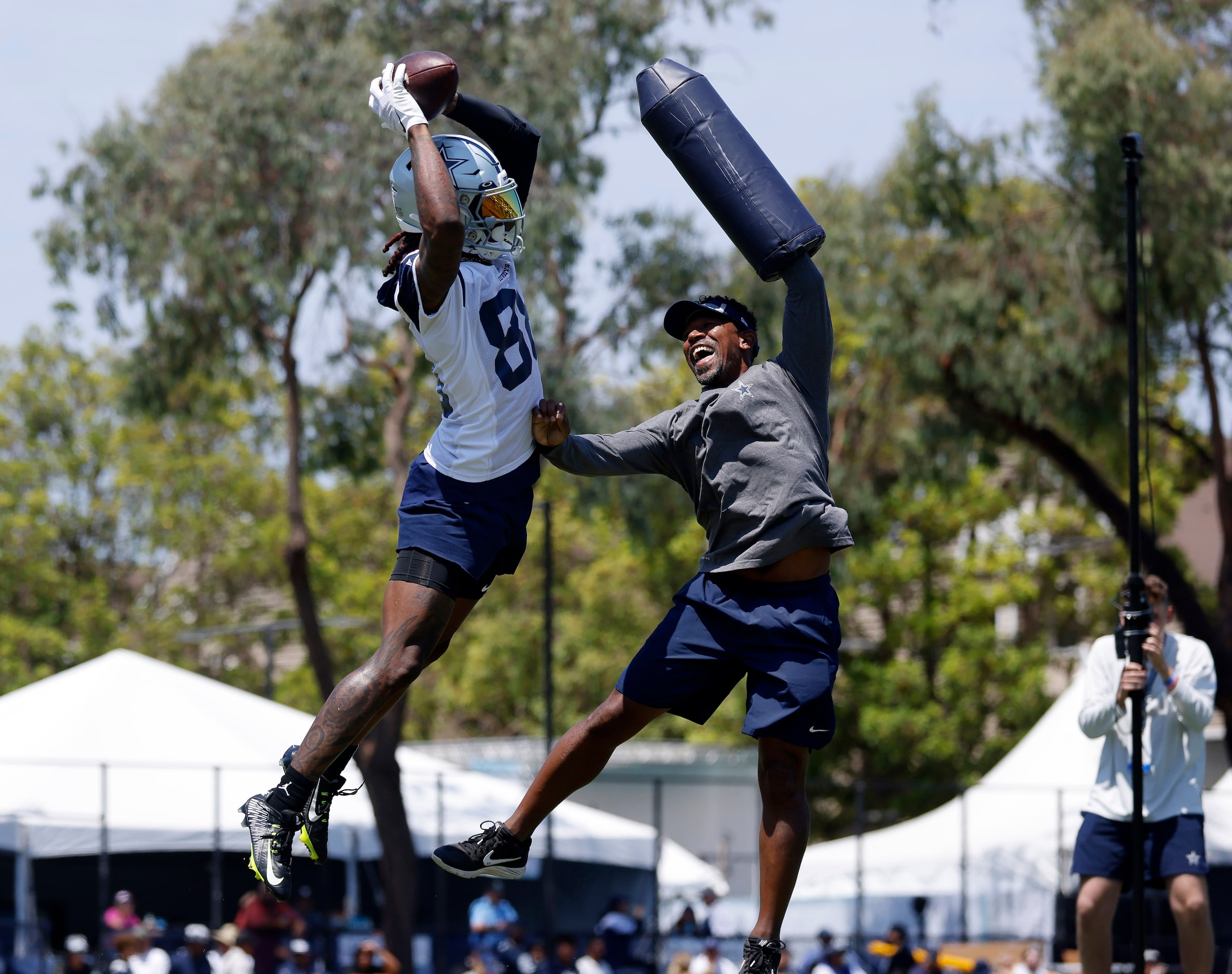 Dallas Cowboys wide receiver CeeDee Lamb (88)   skies over wide receivers coach Robert...