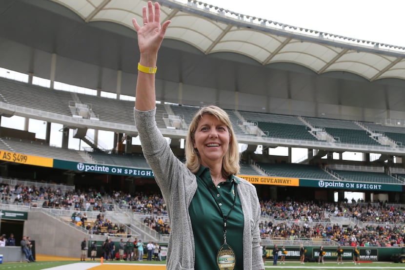 Baylor's new president Linda A. Livingstone waves to the fans as she is introduced during...