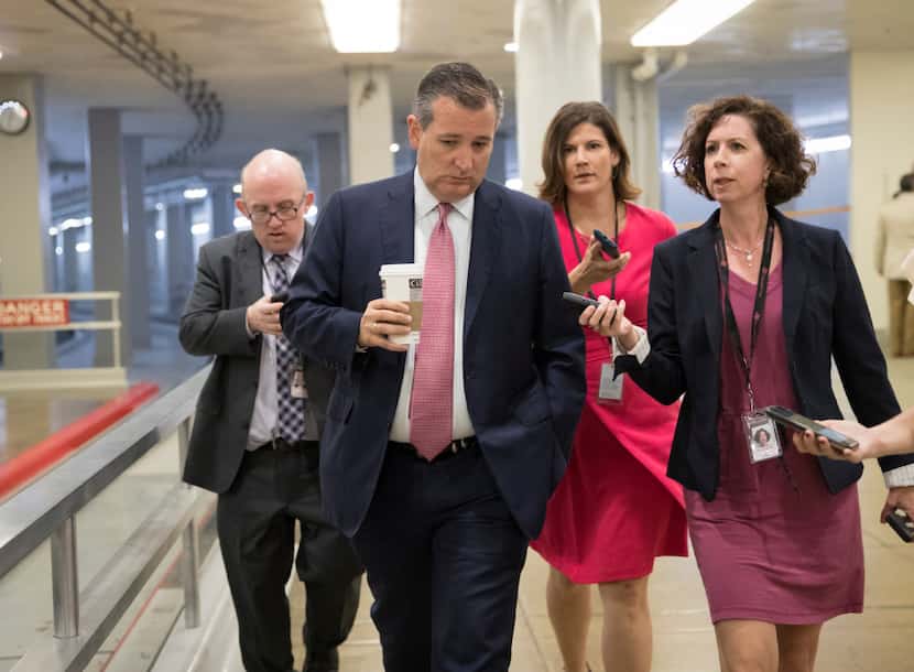 Sen. Ted Cruz, R-Texas, heads to the chamber for a vote, on Capitol Hill in Washington,...