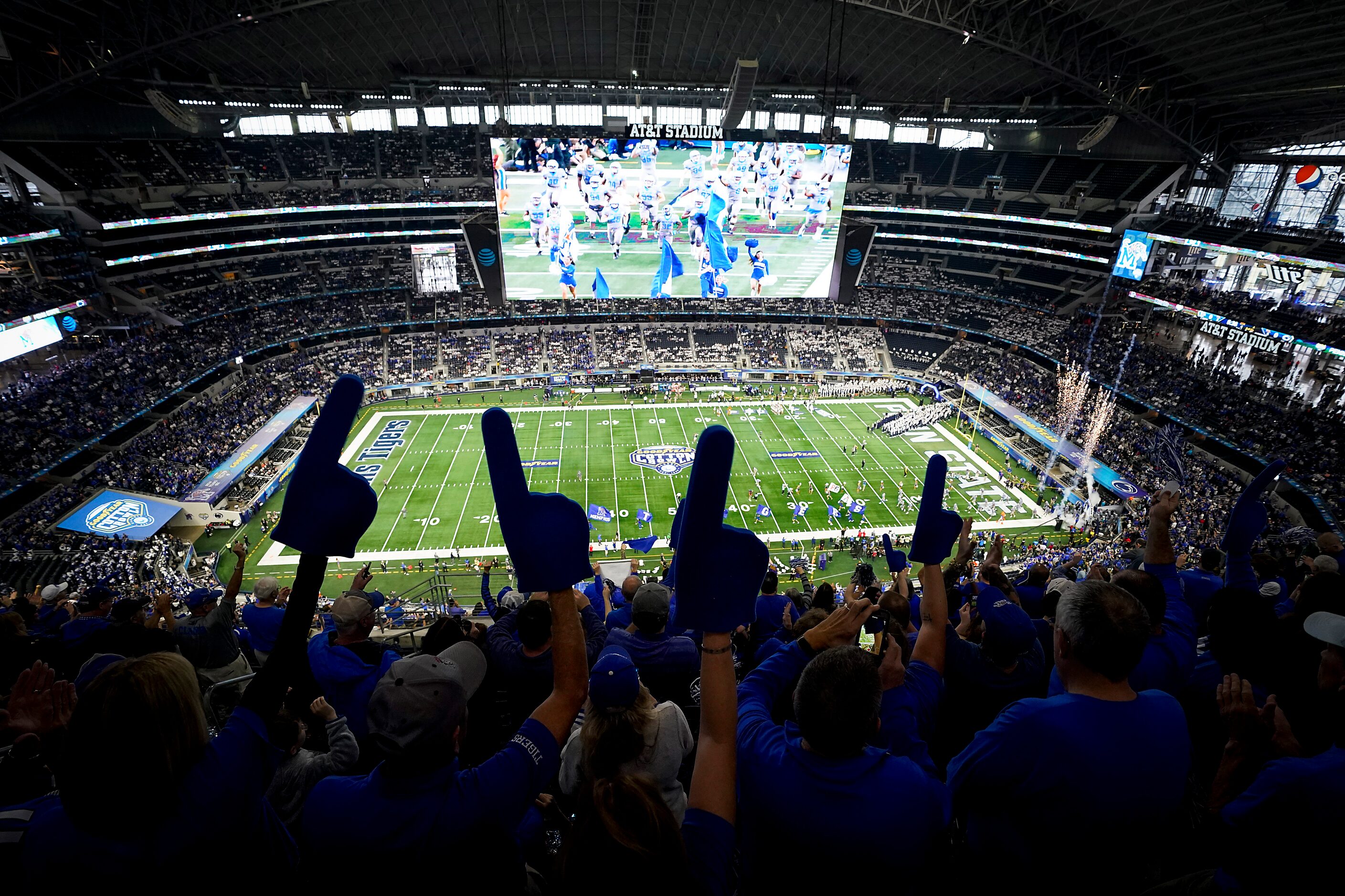 Memphis fans cheer as their team takes the field before the Goodyear Cotton Bowl Classic...