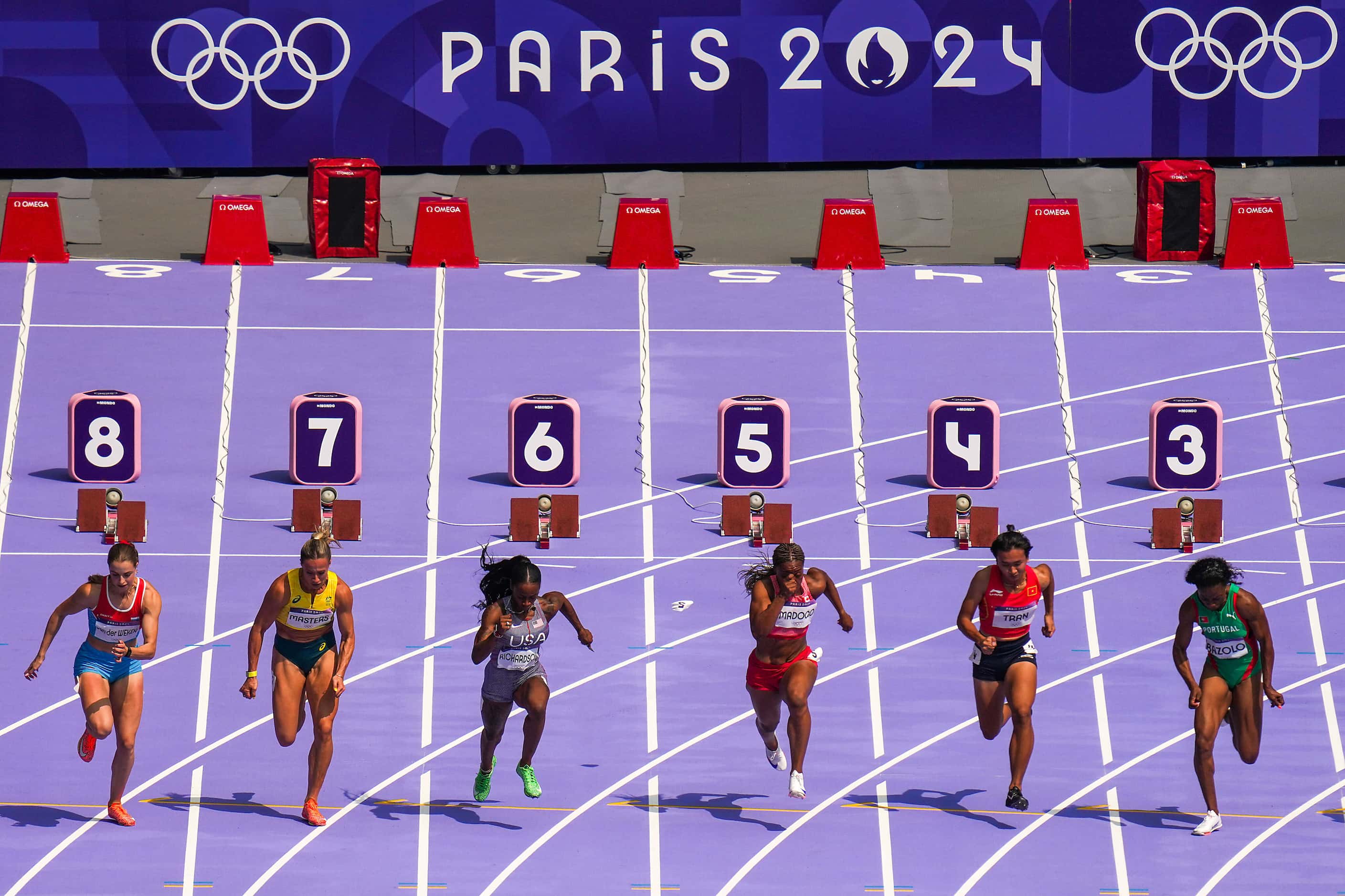 Sha'carri Richardson of the United States (lane six) comes out of the blocks in heat of the...