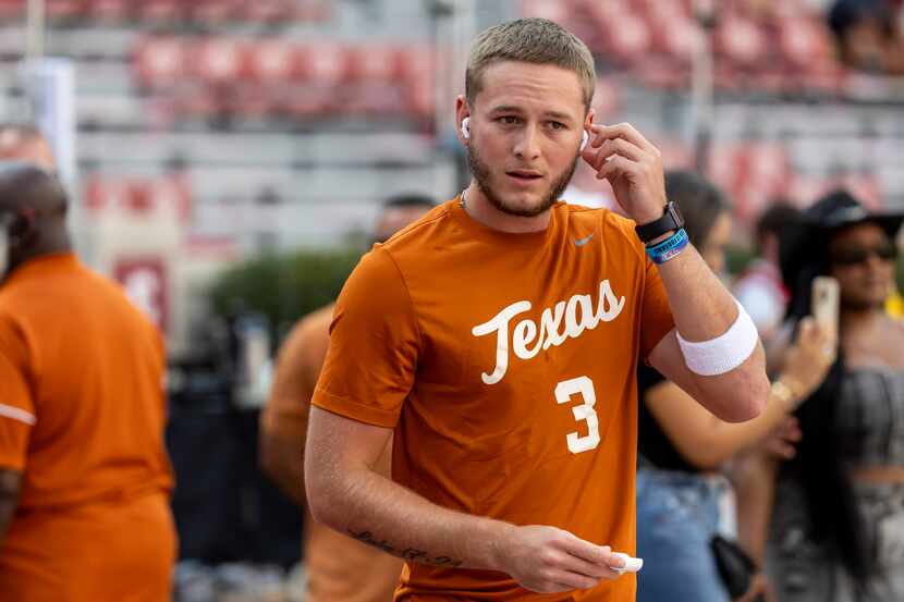 Texas quarterback Quinn Ewers (3) takes the field for early warm-ups before an NCAA college...