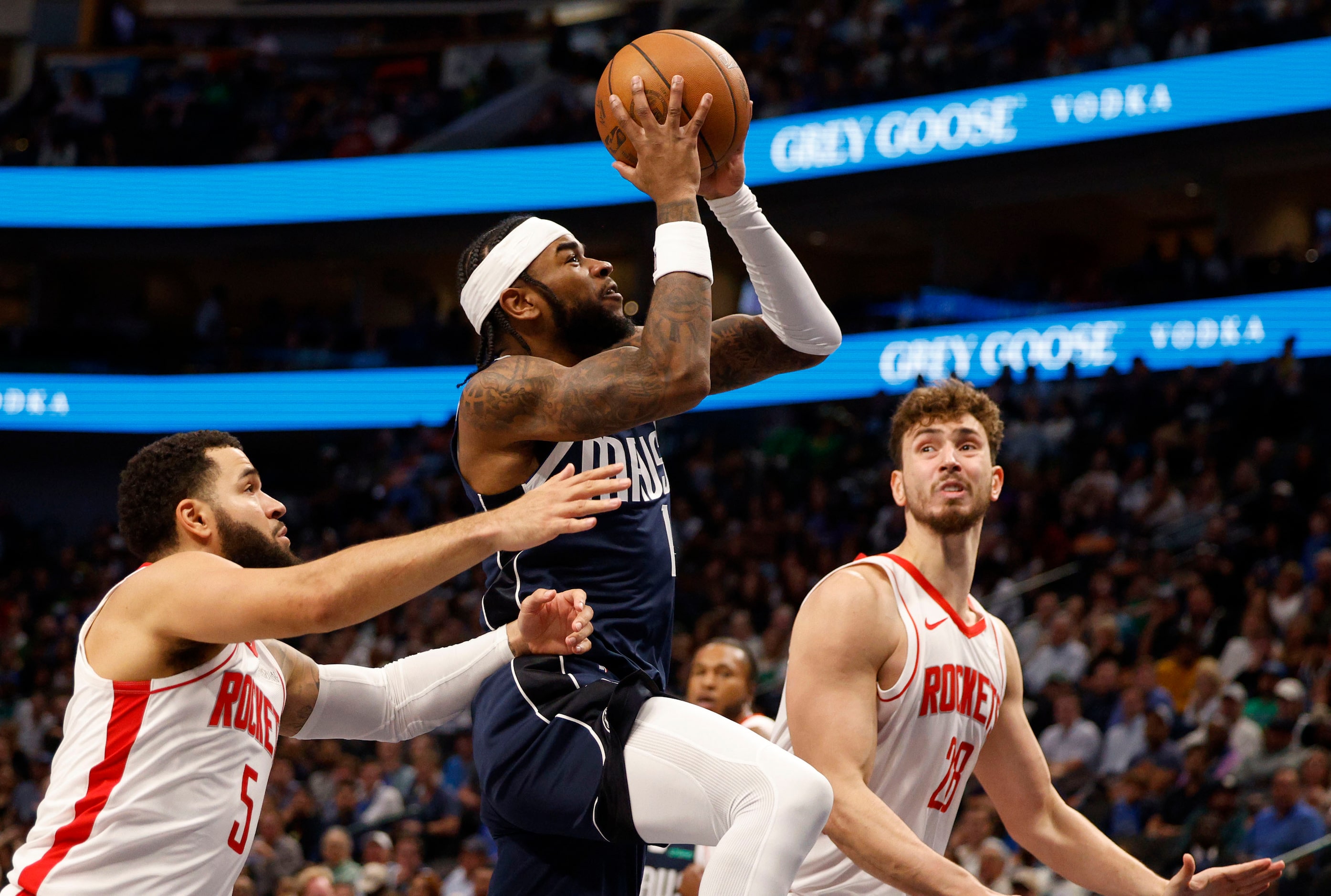 Dallas Mavericks guard Jaden Hardy (1) attempts a jump shot as Houston Rockets guard Fred...