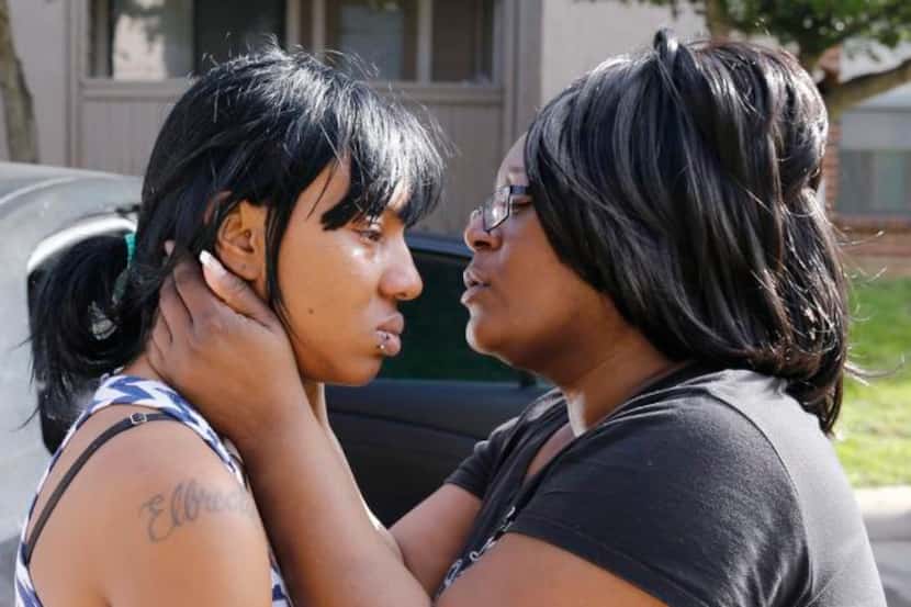 
Patsy Anderson (right) tried to console Lanin Green, who was in the apartment when her...