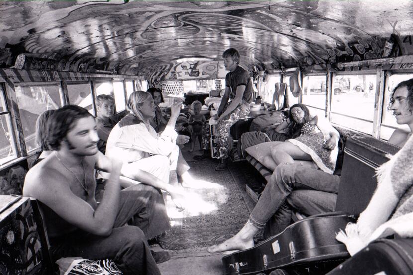 A group from the Merry Pranksters commune hang out on their bus during the Texas...