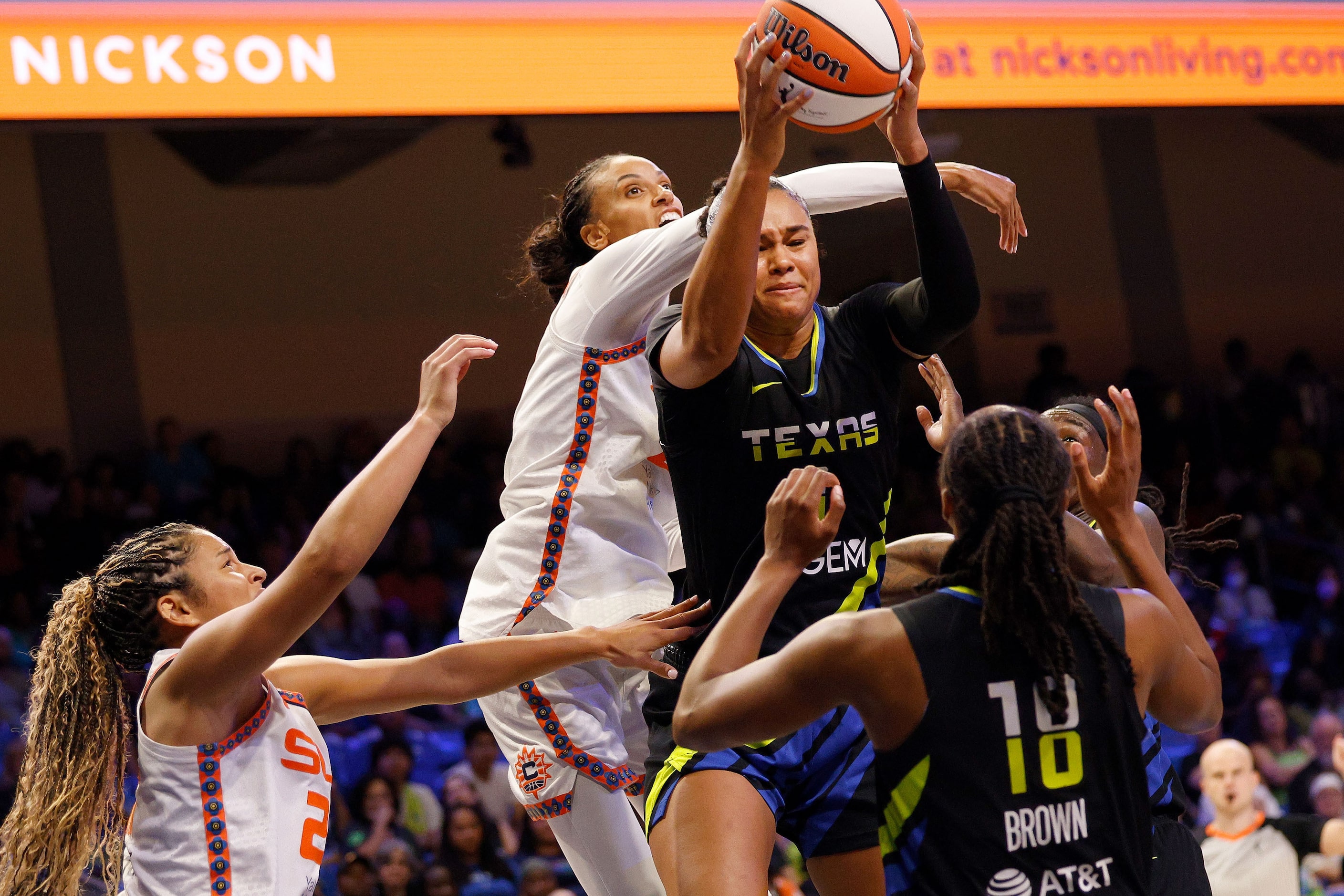 Dallas Wings forward Satou Sabally (0), top right, and Connecticut Sun forward DeWanna...