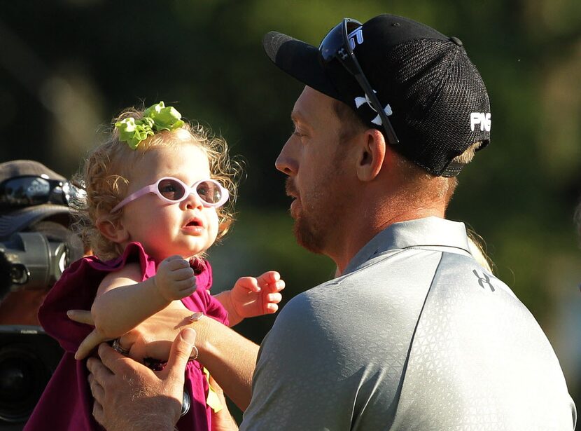 PARAMUS, NJ - AUGUST 24:  Hunter Mahan holds his daughter Zoe celebrates as he celebrates...