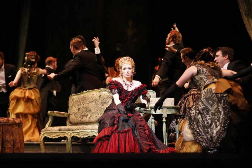 Rachelle Durkin, center, plays as Violetta during a dress rehearsal of opera "La traviata"...