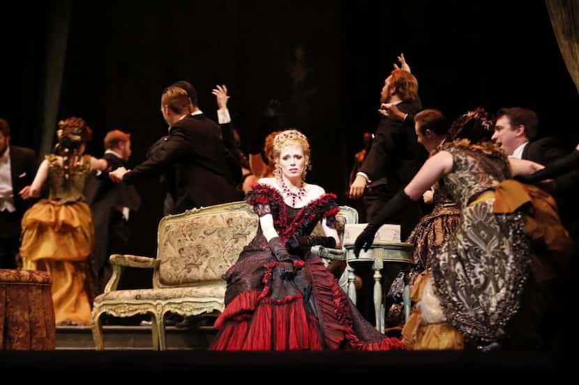 Rachelle Durkin, center, plays as Violetta during a dress rehearsal of opera "La traviata"...