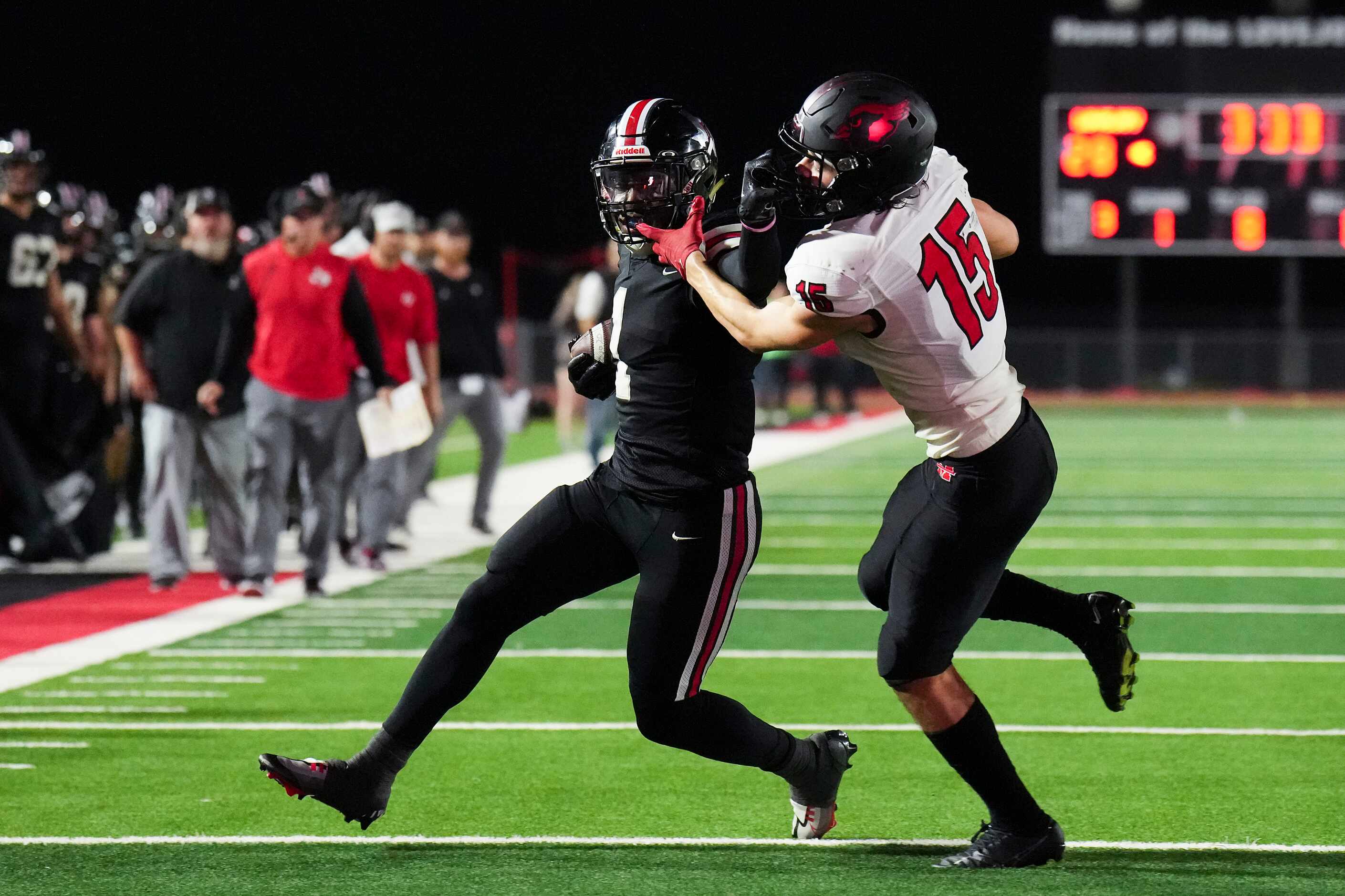 Lovejoy wide receiver Kyle Parker (1) is brouth down by Melissa defensive back Jake Potucek...