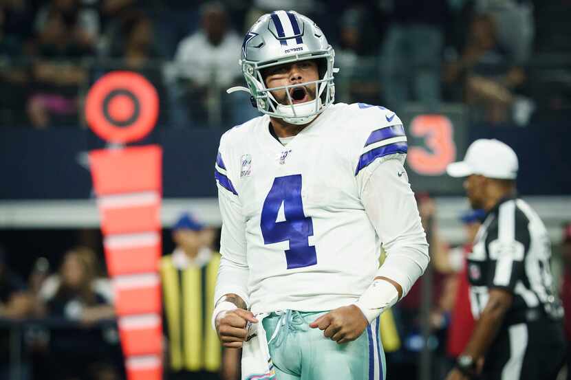 Dallas Cowboys quarterback Dak Prescott (4) celebrates after throwing a touchdown pass to...