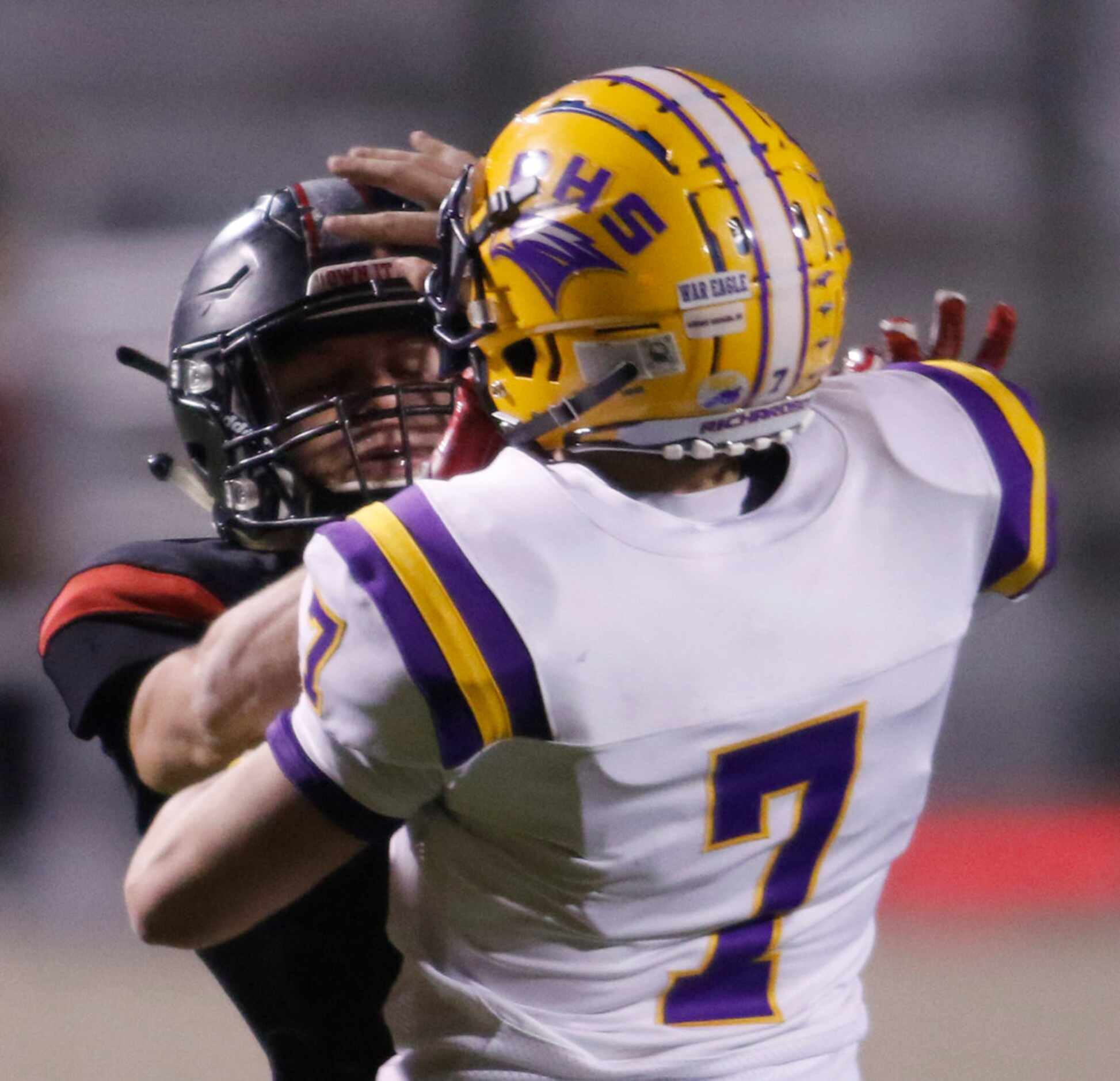 Richardson quarterback Luke Mulvey (7), right, tries to fend off the aggressive rush from...