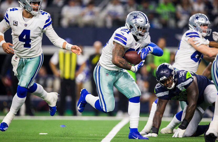 Dallas Cowboys running back Ezekiel Elliott (21) runs to the end zone for a touchdown after...