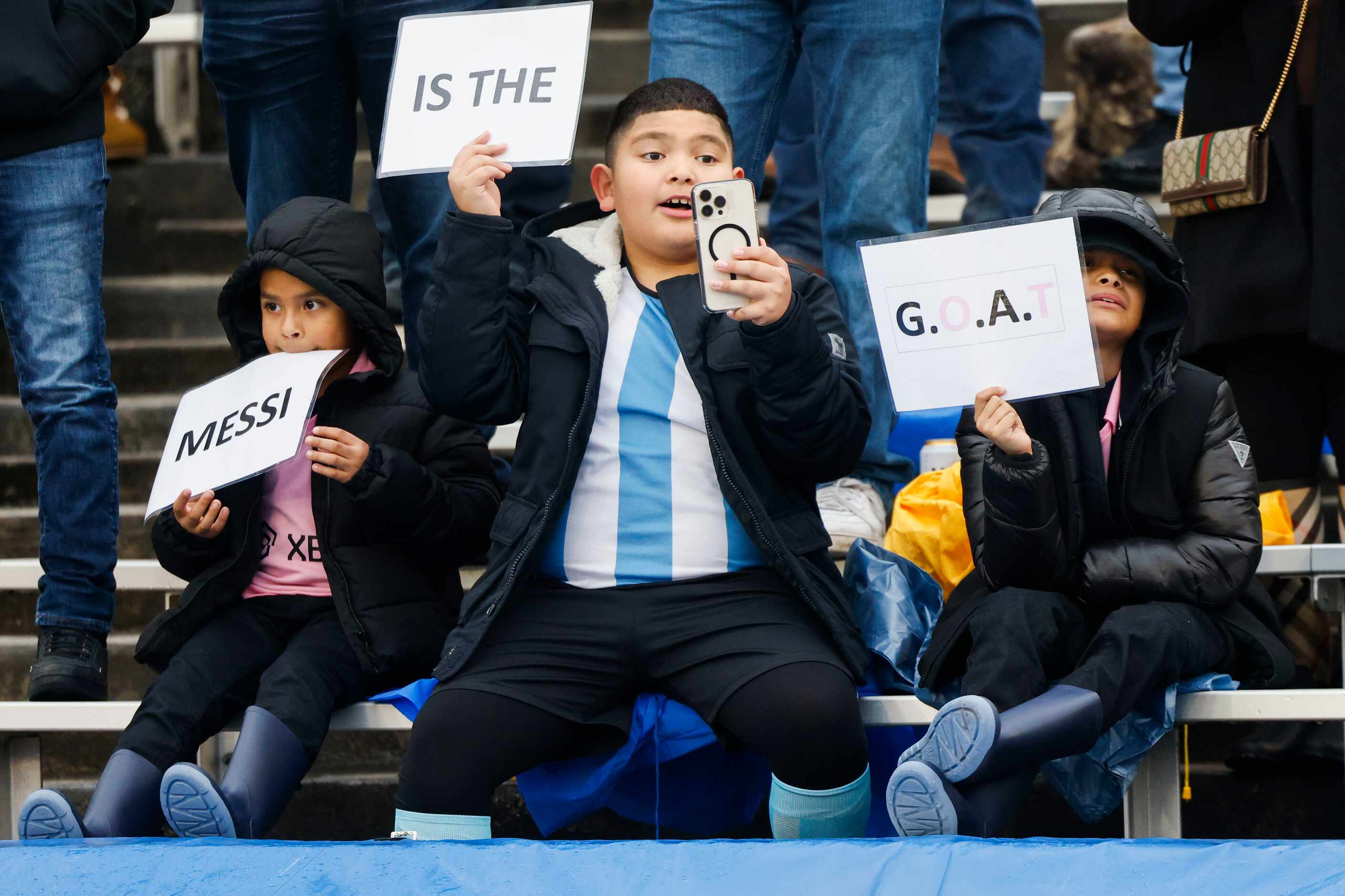 Young fans cheer for Inter Miami forward Lionel Messi ahead of a preseason friendly soccer...