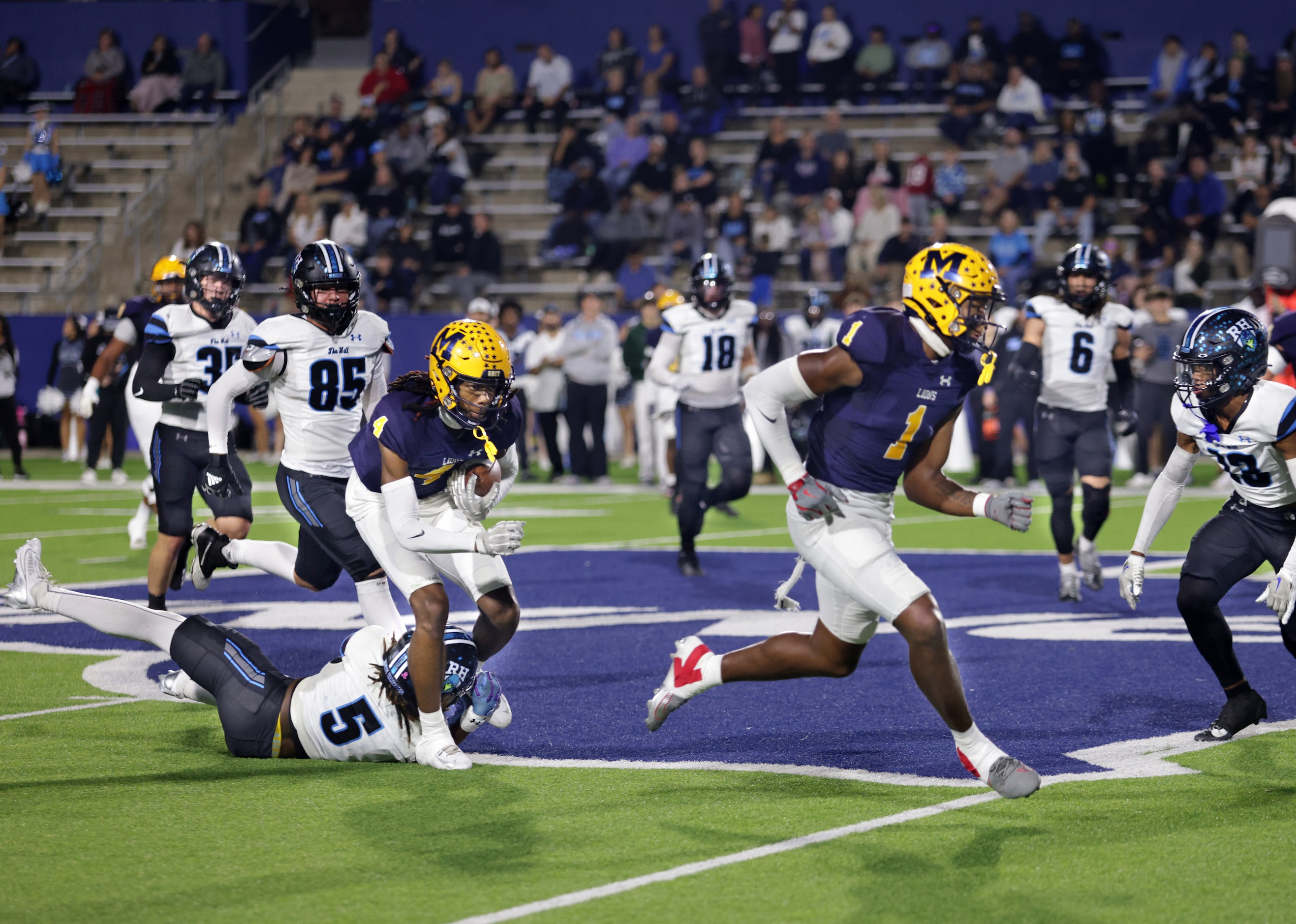 McKinney player #4 Ja'bree Bickham breaks a tackle attempt by Rock Hill player #5 Armaree...