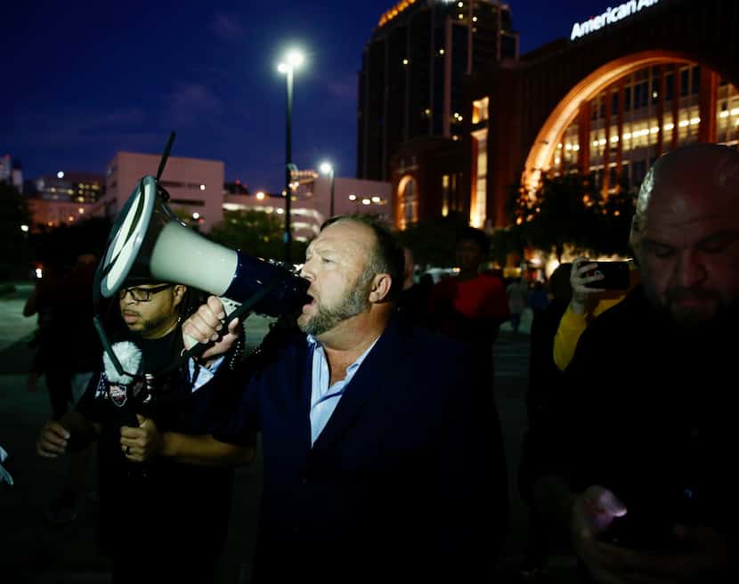 Alex Jones speaks with a bullhorn where  some of the protesters are at the site of the Keep...