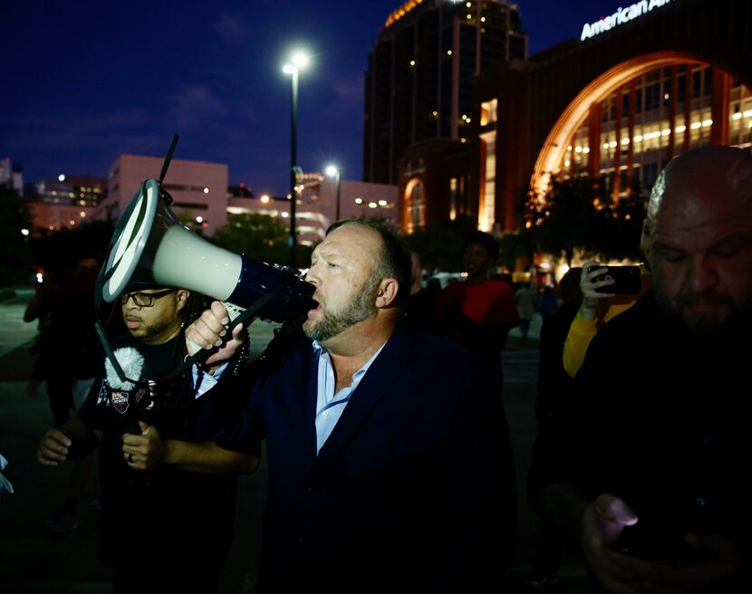 Alex Jones speaks with a bullhorn where  some of the protesters are at the site of the Keep...