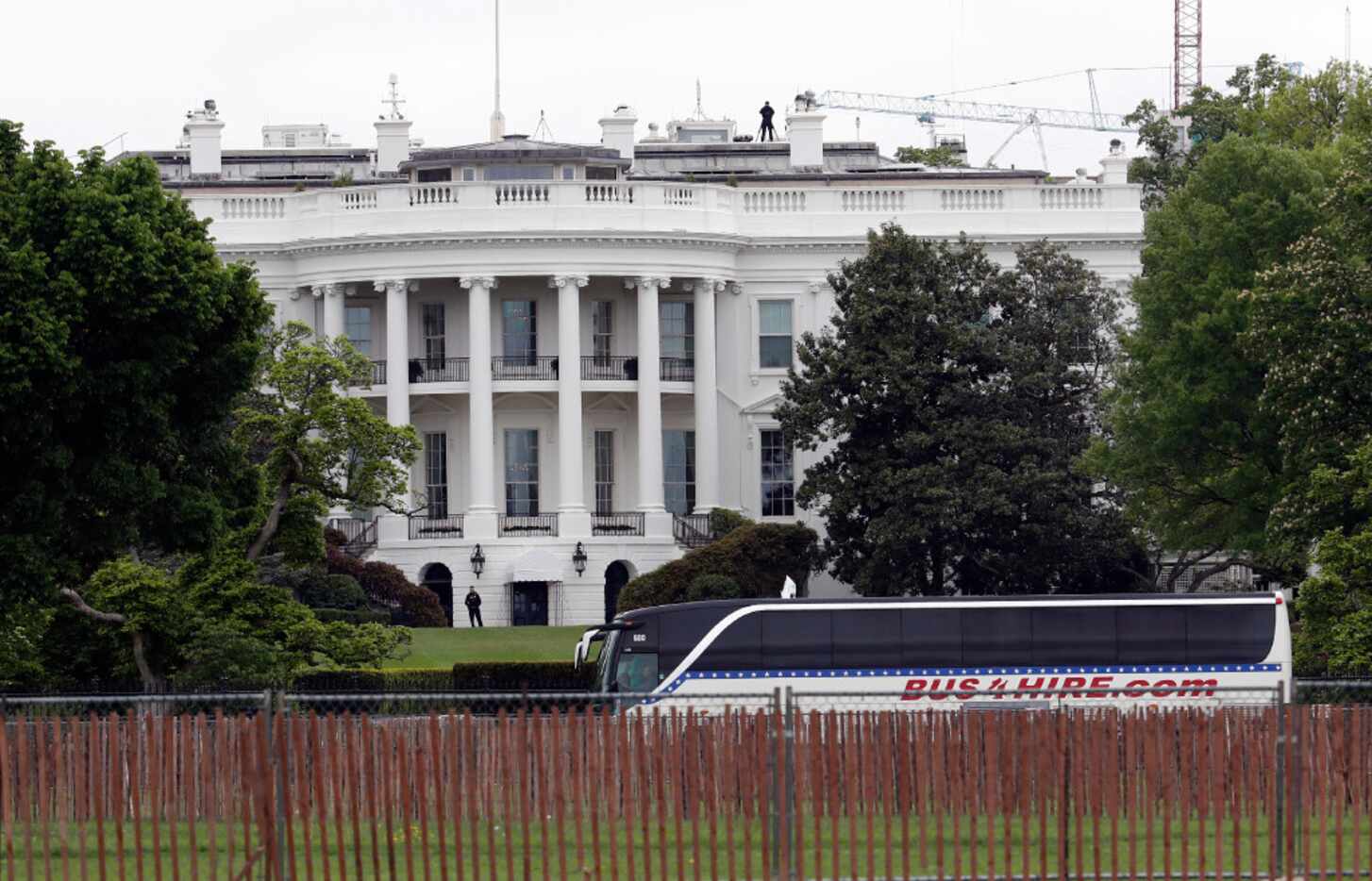 A bus carrying senators arrives at the White House for a briefing on the threat posed by...