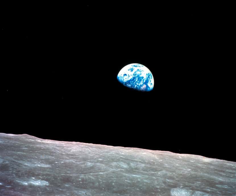 This Dec. 24, 1968, file photo made available by NASA shows the Earth behind the surface of...