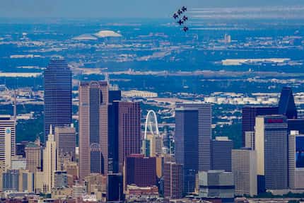 The U.S. Navy Blue Angels fly over the downtown Dallas skyline on Wednesday, May 6, 2020. 
