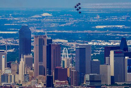 The U.S. Navy Blue Angels fly over the downtown Dallas skyline on Wednesday, May 6, 2020. 