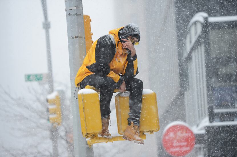 NEW YORK, NY: Teddy Rossi rises above the elements in midtown Manhattan during  a snowstorm...