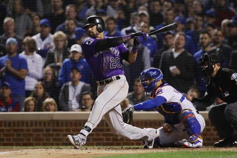 CHICAGO, IL - OCTOBER 02:  Ian Desmond #20 of the Colorado Rockies grounds into fielder's...