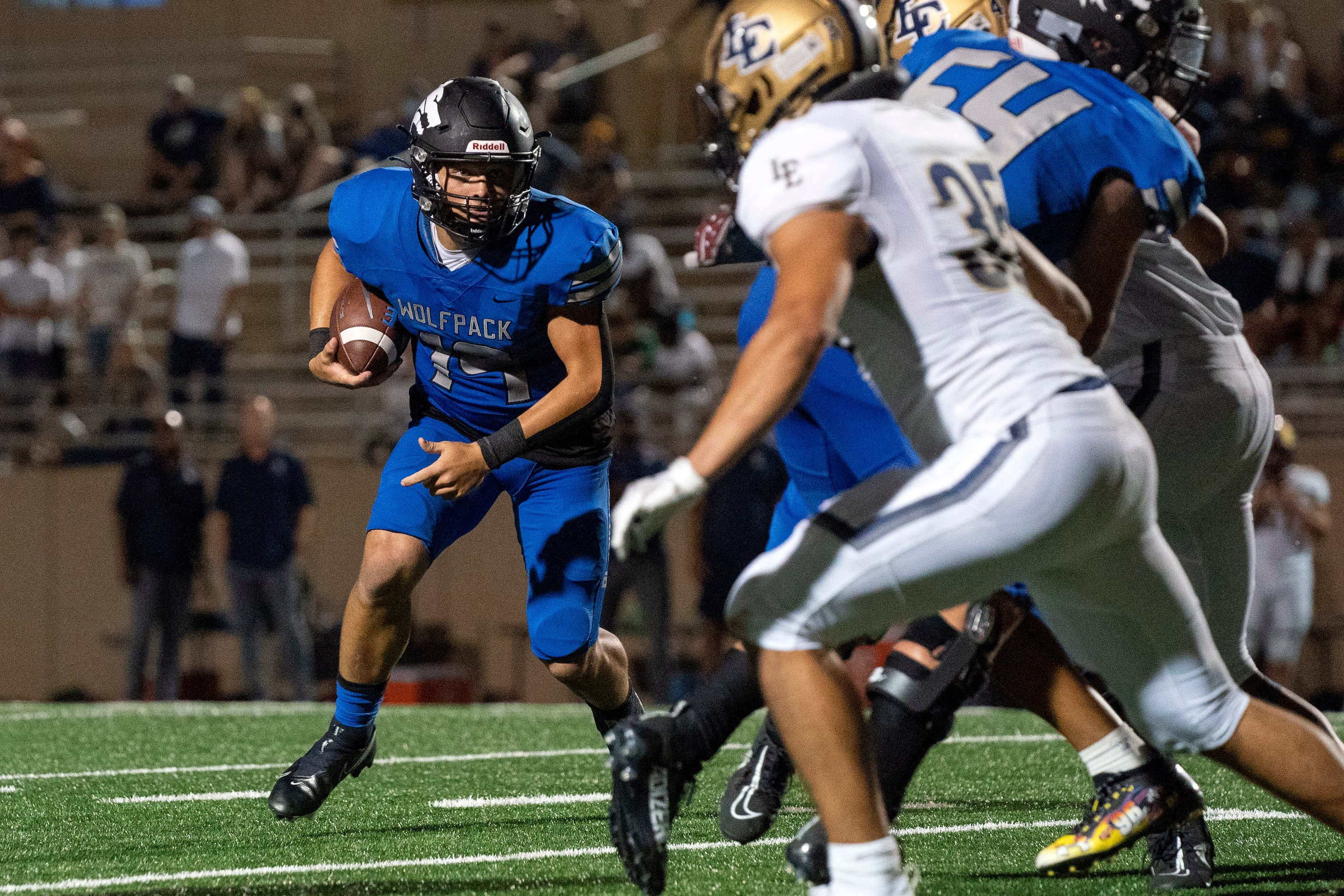 Plano West junior quarterback Vance Feuerbacher (19) turns upfield against Little Elm during...