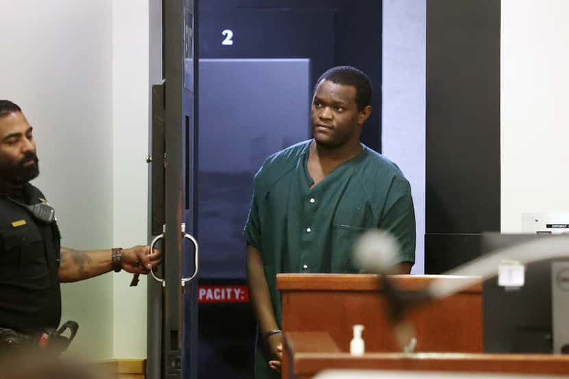 Reginald Kimbro enters the courtroom of Tarrant County's 213th District Court on Friday...