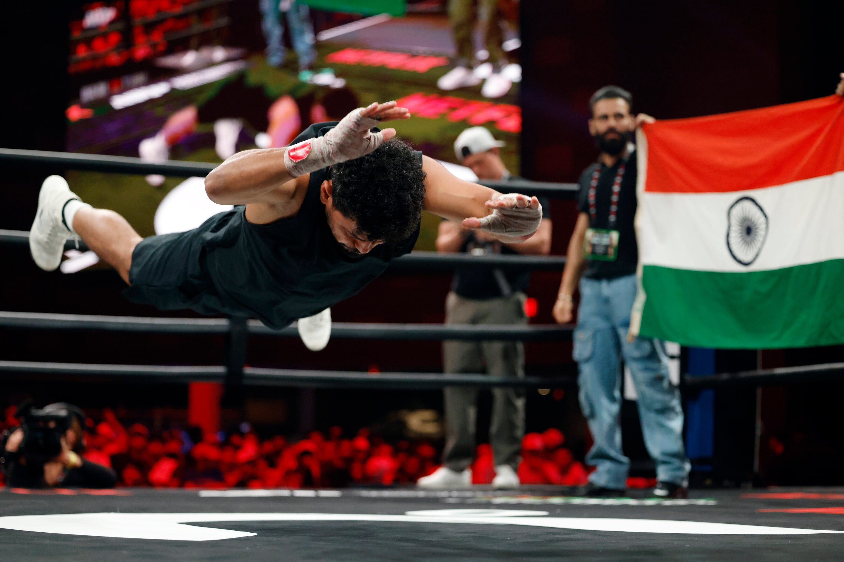 India’s Neeraj Goyat does a jumping push-up during an open workout ahead of his boxing match...