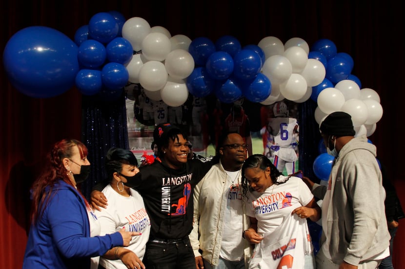 Da'Myrion Coleman sports a smile as he waits for family and supporters to join him for a...