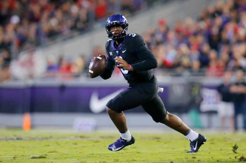TCU Horned Frogs quarterback Shawn Robinson (3) rolls out looking for a receiver against the...