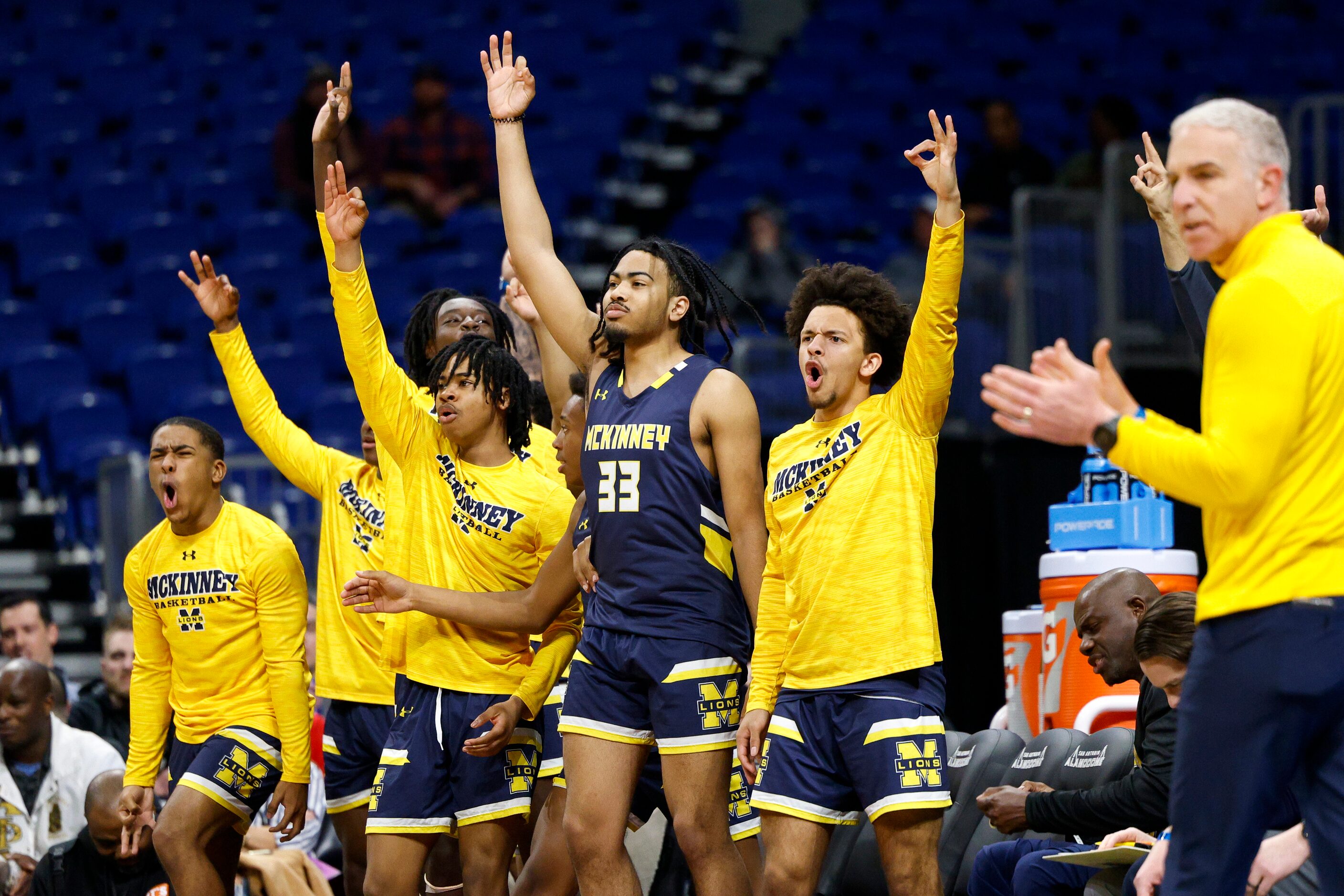 McKinney players celebrate a three-point shot during the first quarter of a Class 6A state...