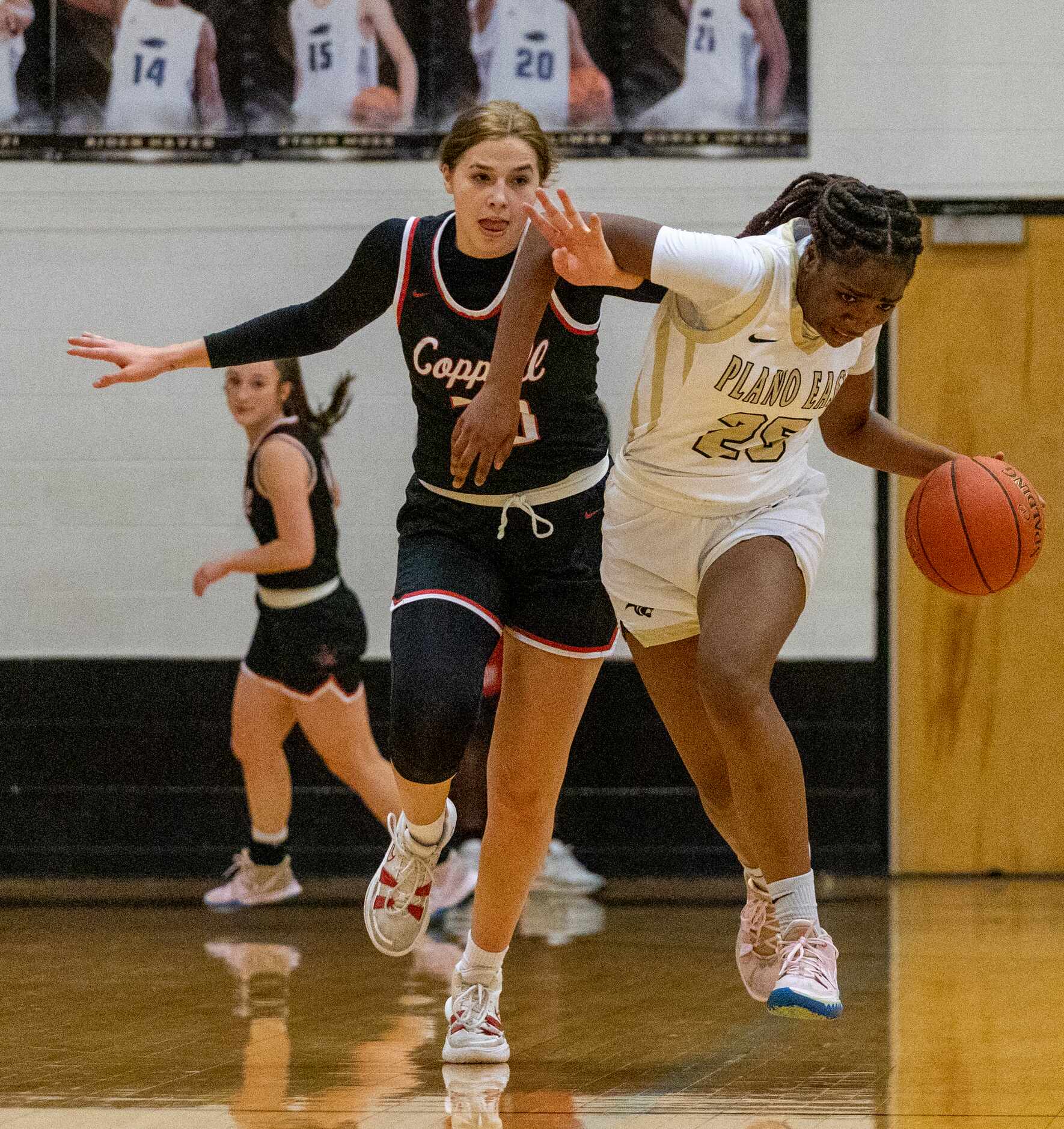 Coppell High School Julianna Lamendola (20) puts her hand through the arm of Plano East High...