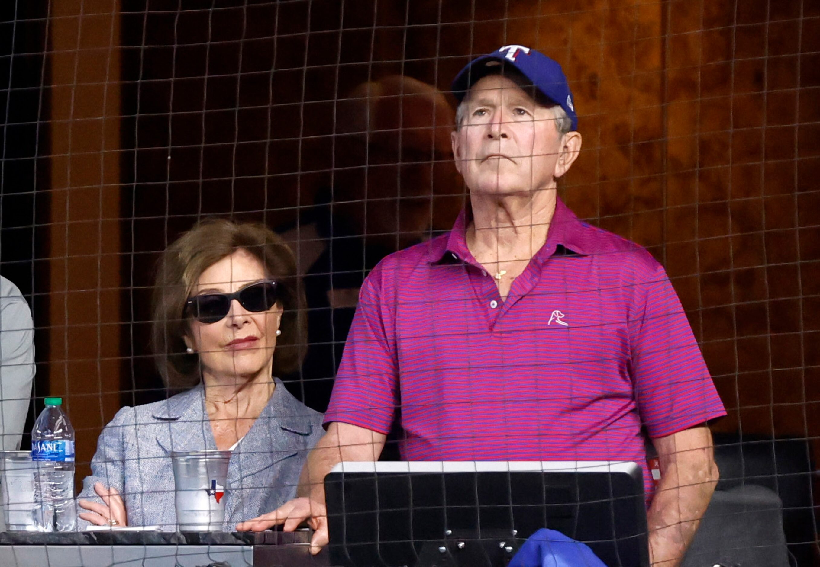 Former President George W. Bush and First Lady Laura Bush take in Game 5 of the American...