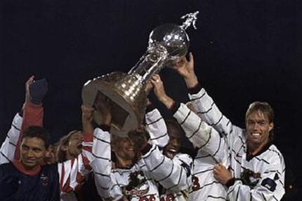 The Dallas Burn hoist the Dewar Cup after winning the 1997 US Open Cup. 