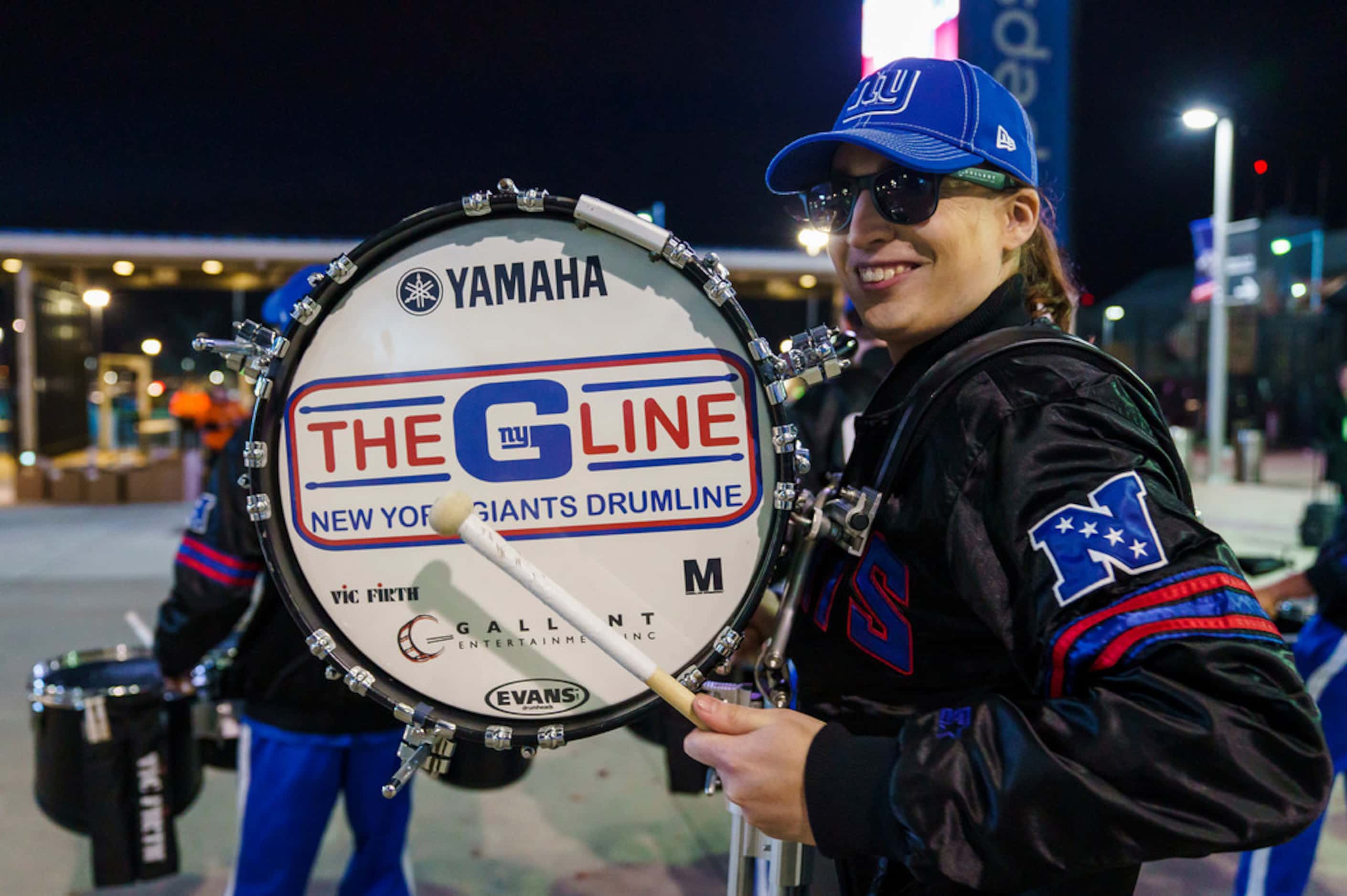 New York Giants drum line performs outside the stadium as fans tailgate before a Monday...