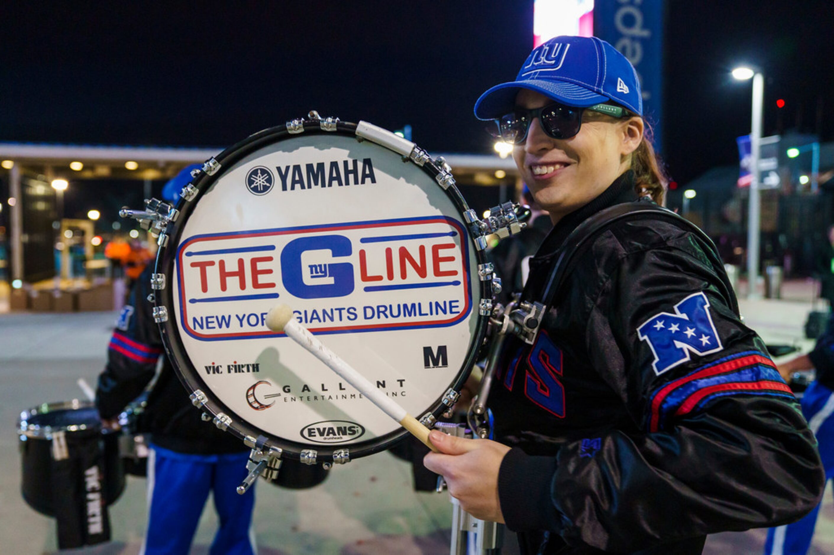 New York Giants drum line performs outside the stadium as fans tailgate before a Monday...