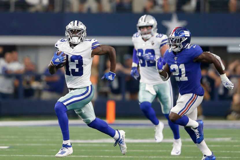 Cowboys wide receiver Michael Gallup (13) runs after a catch as he's chased by New York...