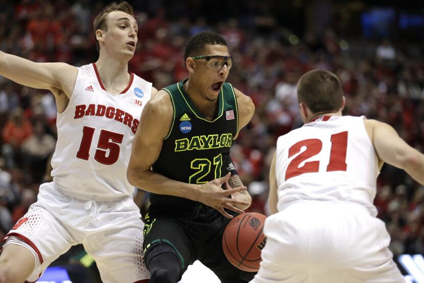 Baylor center Isaiah Austin (21) is pressured by Wisconsin's Sam Dekker (15) and Josh Gasser...
